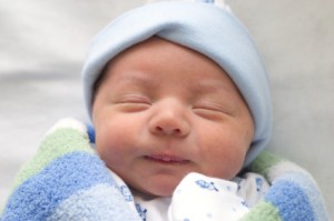 Newborn wrapped in blue Newborn wrapped in blue