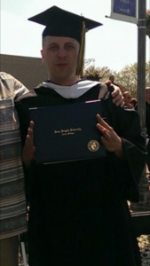 William Miko - Today's Face of Recovery - pictured here receiving this Bachelor's degree diploma.